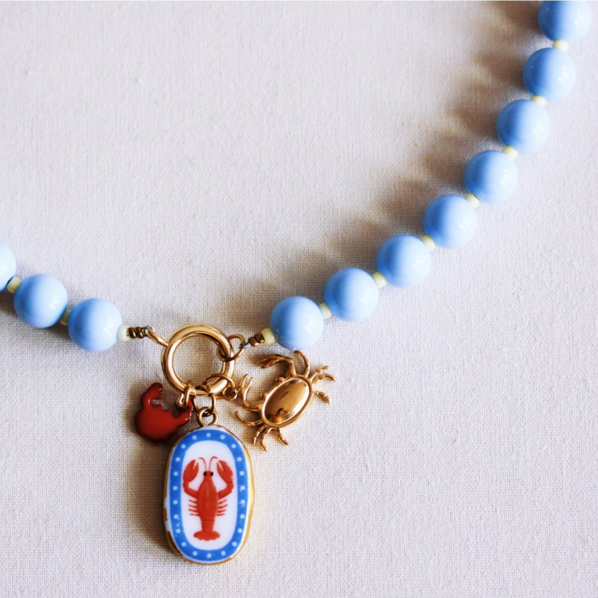 Beaded necklace with Miyuki beads with charms - light blue/yellow