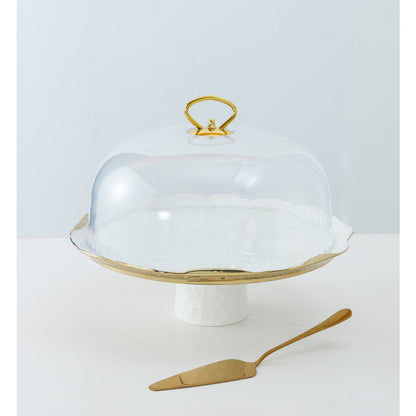 White porcelain cake bell with gold edges with pie shovel