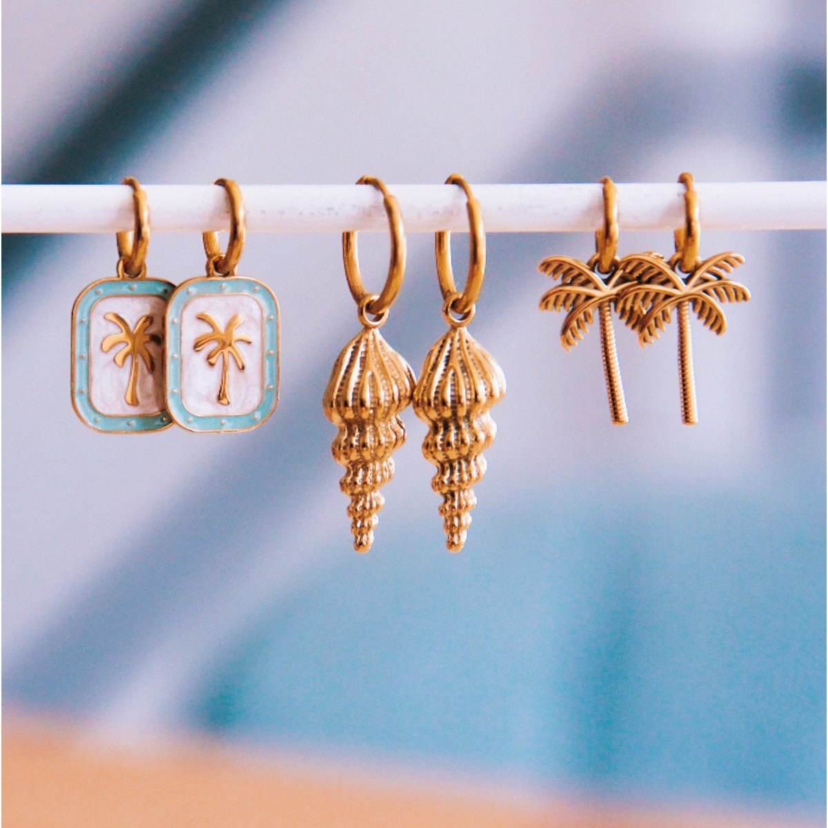 Stainless steel hoop earrings with palm tree