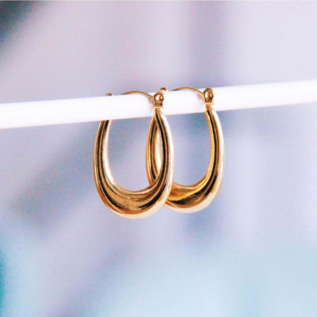 Stainless steel oval earring flared