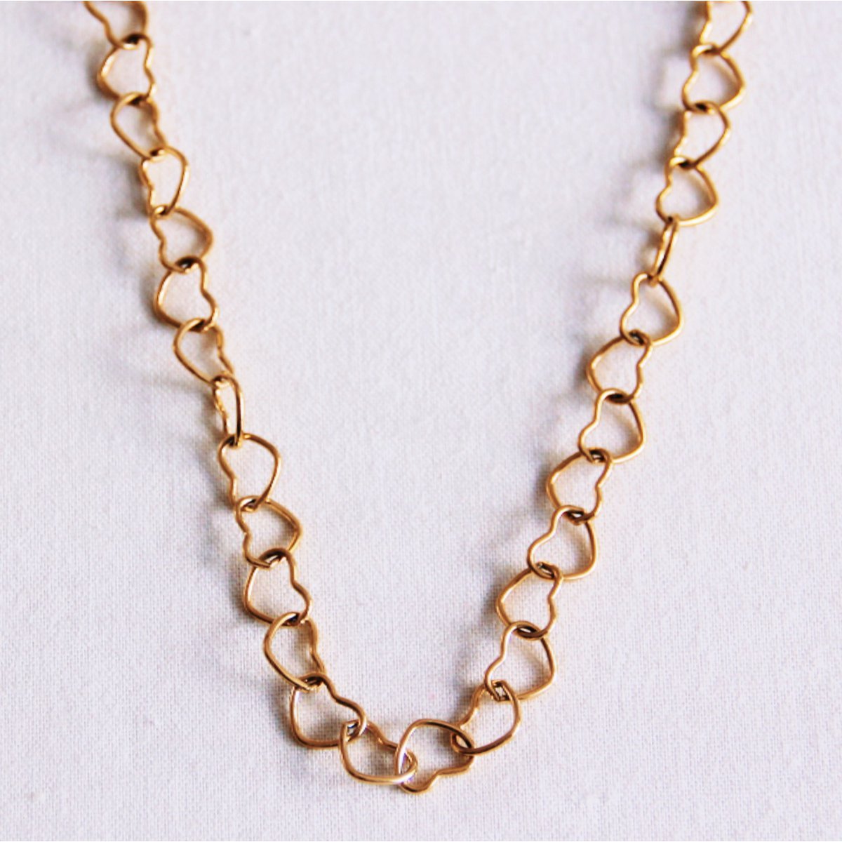 Linked hearts necklace