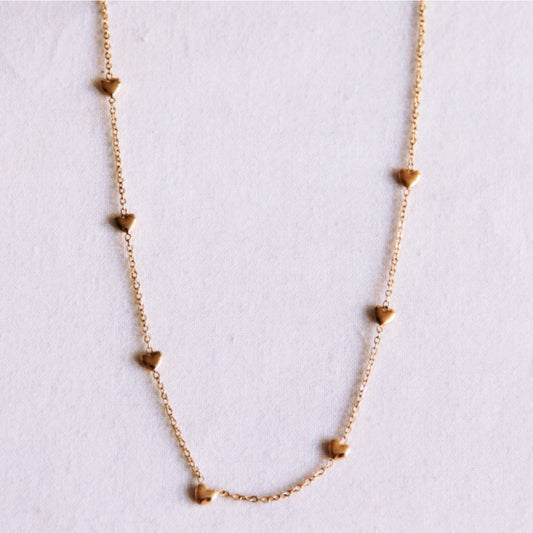 Delicate necklace with hearts - gold
