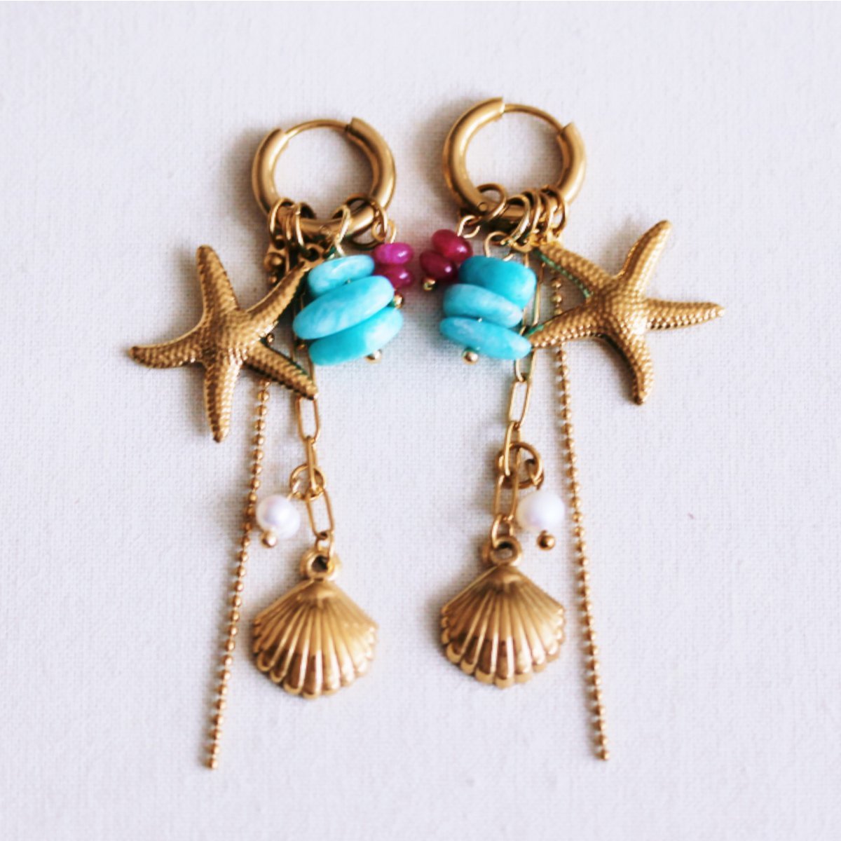Stainless steel hoop earrings with starfish, shell, chains, and pearl - fuchsia/mint