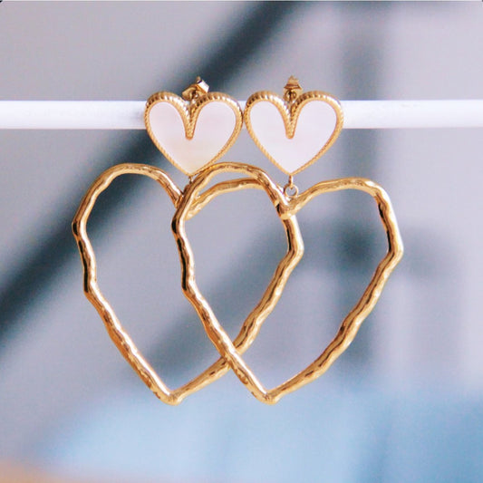 Statement earring with mother of pearl and open heart