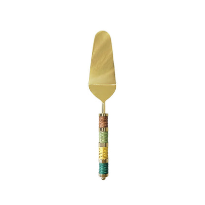 Golden pie server with multicolored braided handle