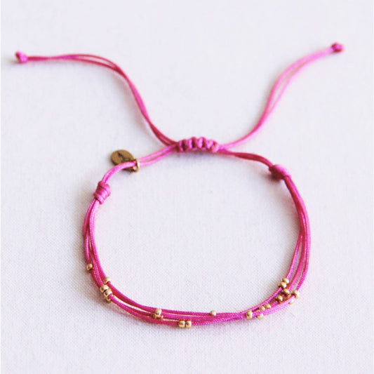 Quadruple satin bracelet with beads - fuchsia
