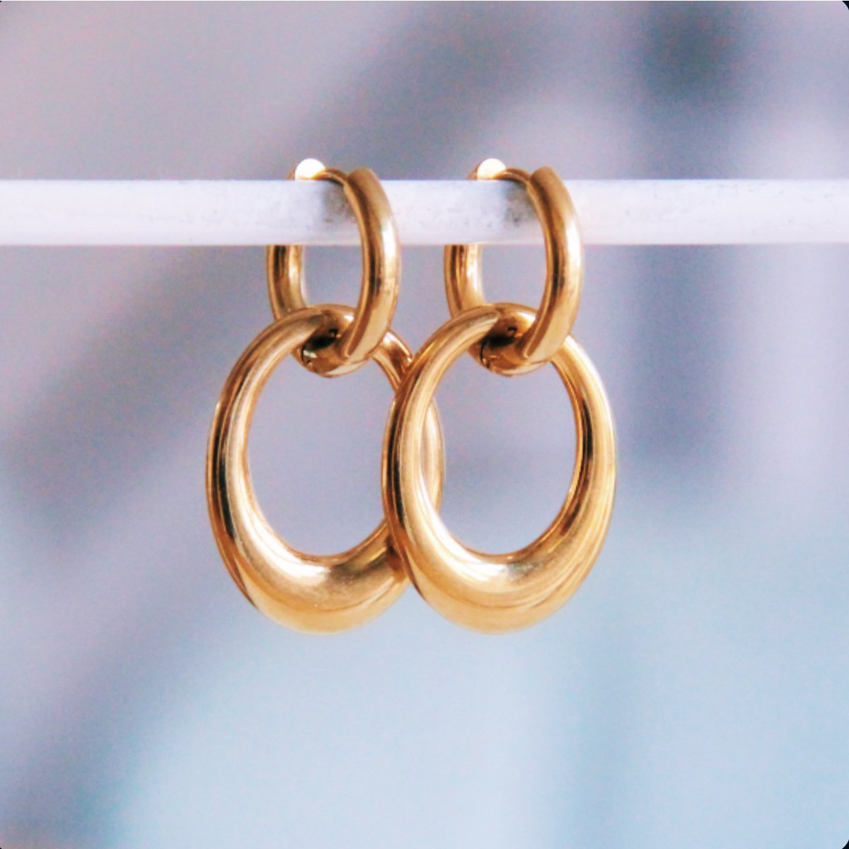 Wide hoop with oval pendant