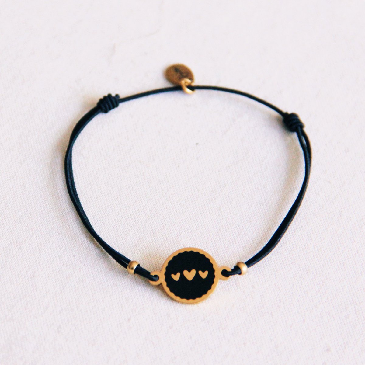 Elastic bracelet with 3 heart charms - black/gold