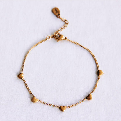Delicate bracelet with hearts - gold