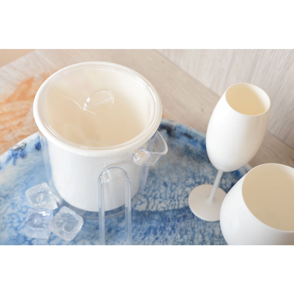 White acrylic ice bucket with pliers