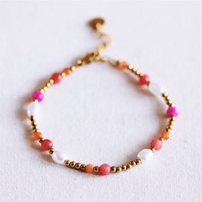 Beaded bracelet with pearls and facets - coral/orange/pink