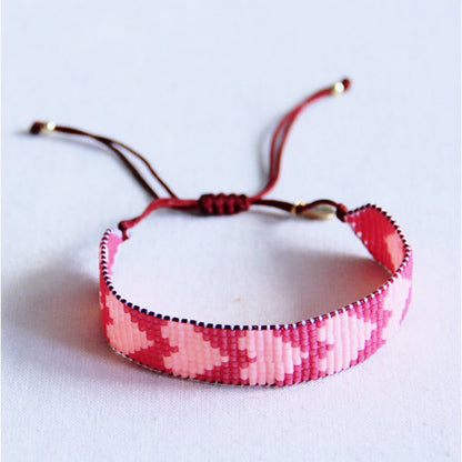 Woven bracelet with hearts - hot pink/peach