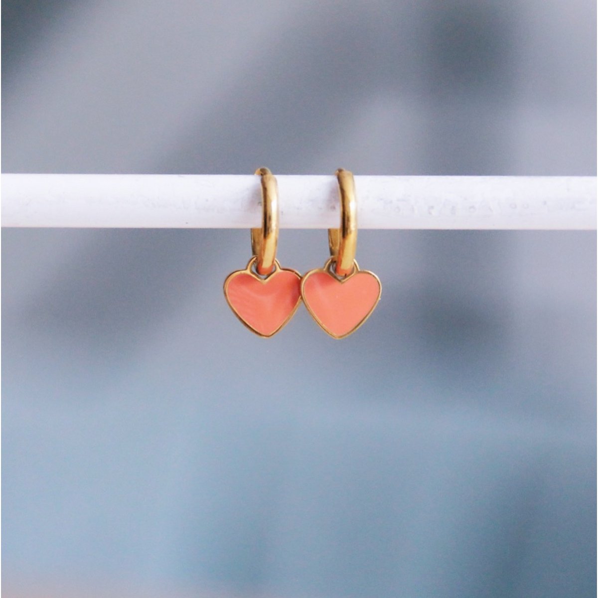 Stainless steel hoop earrings with mini heart – coral