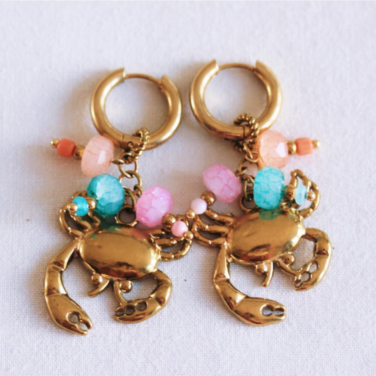 Stainless steel hoop earrings with crab and colored stones